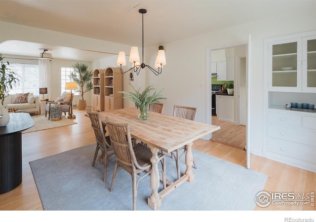 1539 Peterson St, Fort Collins, CO 80524 - dining room with a chandelier and light wood-style floors