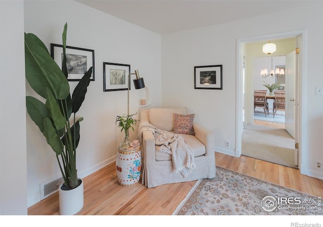1539 Peterson St, Fort Collins, CO 80524 - sitting room featuring wood finished floors and a chandelier