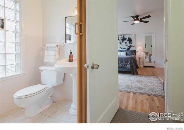 1539 Peterson St, Fort Collins, CO 80524 - half bathroom with wood finished floors, plenty of natural light, and ceiling fan