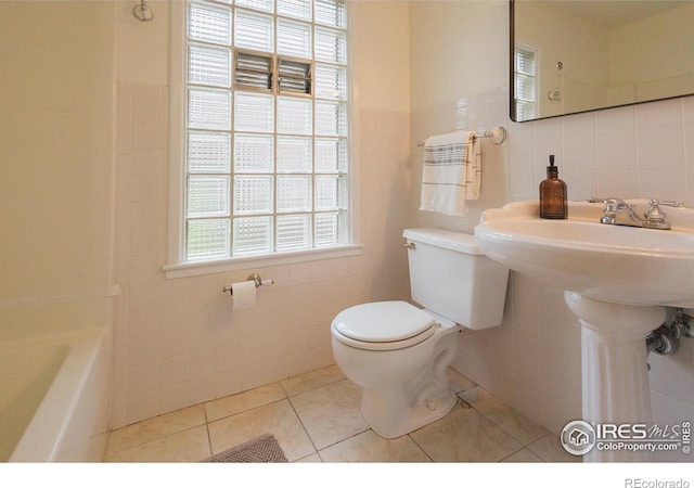 1539 Peterson St, Fort Collins, CO 80524 - bathroom featuring tile walls and tile patterned flooring