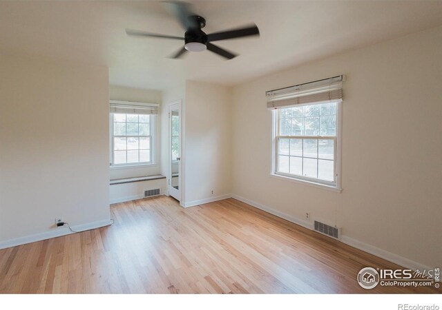 1539 Peterson St, Fort Collins, CO 80524 - empty room featuring healthy amount of natural light, wood finished floors, and a ceiling fan