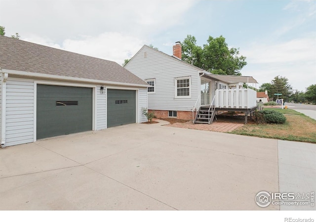 1539 Peterson St, Fort Collins, CO 80524 - view of side of home featuring a deck, a chimney, and a shingled roof