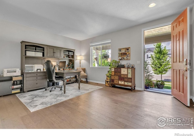 6244 Waterman Way, Frederick, CO 80516 - office area with wood finished floors and recessed lighting