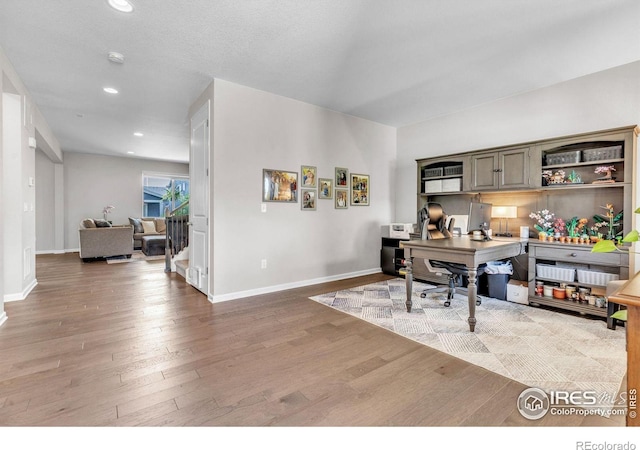 6244 Waterman Way, Frederick, CO 80516 - home office featuring wood finished floors and recessed lighting