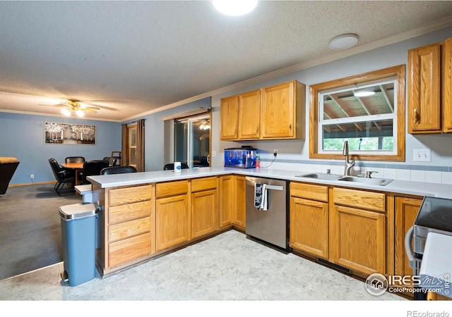 611 Elizabeth Ave, Platteville, CO 80651 - kitchen with stainless steel appliances, a peninsula, a textured ceiling, ornamental molding, and light countertops