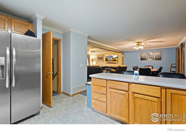 611 Elizabeth Ave, Platteville, CO 80651 - kitchen with stainless steel fridge with ice dispenser, ceiling fan, crown molding, a textured ceiling, and open floor plan