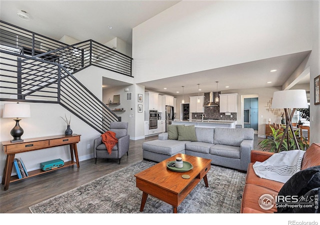 19239 W 88th Dr, Arvada, CO 80007 - living room featuring wood finished floors and stairs