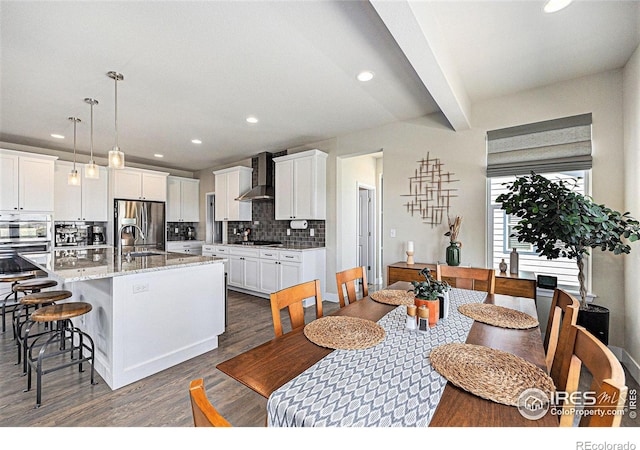 19239 W 88th Dr, Arvada, CO 80007 - dining room with dark wood-type flooring and recessed lighting