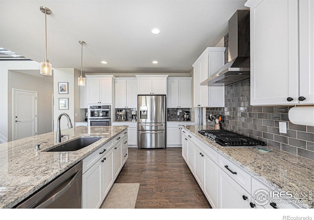 19239 W 88th Dr, Arvada, CO 80007 - kitchen with stainless steel appliances, wall chimney exhaust hood, white cabinetry, backsplash, and recessed lighting