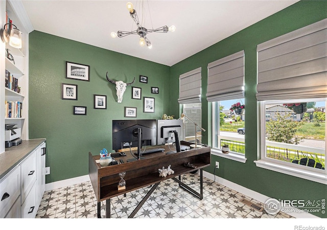 19239 W 88th Dr, Arvada, CO 80007 - office space with light floors and a chandelier