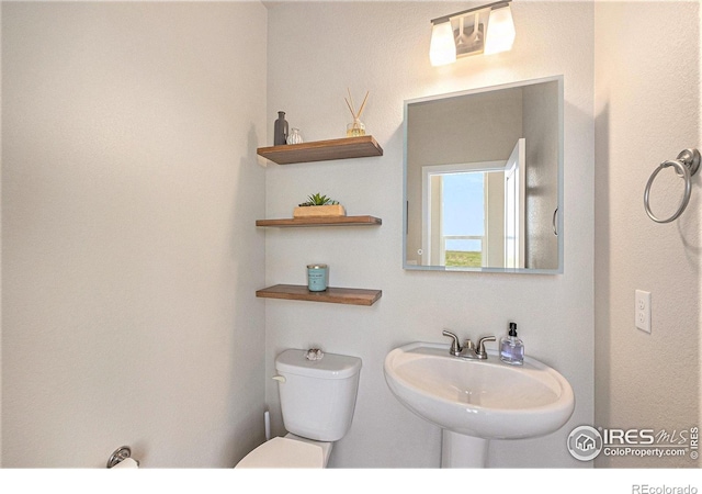 19239 W 88th Dr, Arvada, CO 80007 - half bath with toilet and a sink