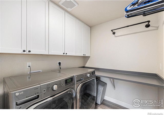 19239 W 88th Dr, Arvada, CO 80007 - washroom featuring cabinet space and washer and dryer