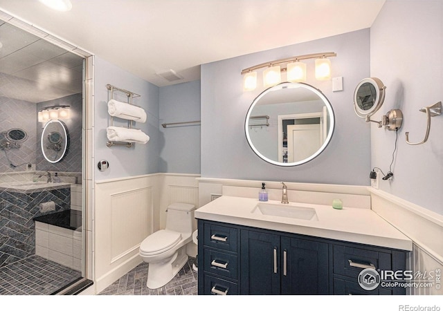 19239 W 88th Dr, Arvada, CO 80007 - bathroom with vanity, wainscoting, and a shower with door