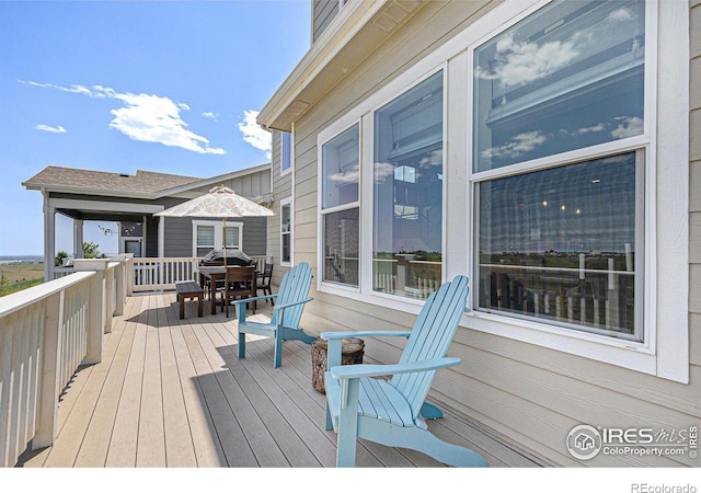 19239 W 88th Dr, Arvada, CO 80007 - deck featuring outdoor dining space