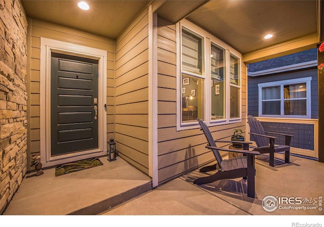 19239 W 88th Dr, Arvada, CO 80007 - doorway to property with covered porch