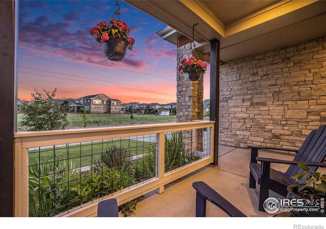 19239 W 88th Dr, Arvada, CO 80007 - view of balcony at dusk