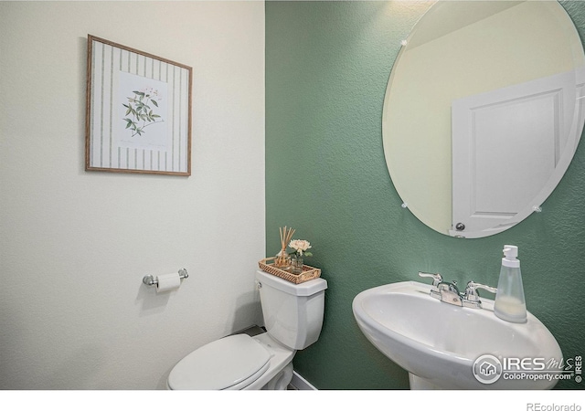 7415 E 158th Pl, Thornton, CO 80602 - bathroom featuring a sink and toilet