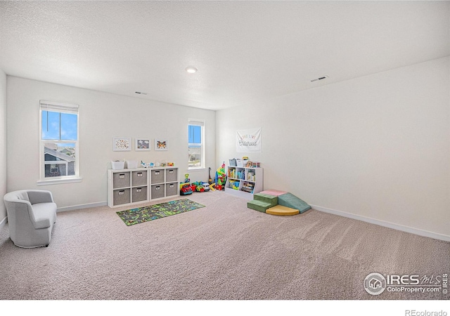 7415 E 158th Pl, Thornton, CO 80602 - playroom with carpet floors and plenty of natural light