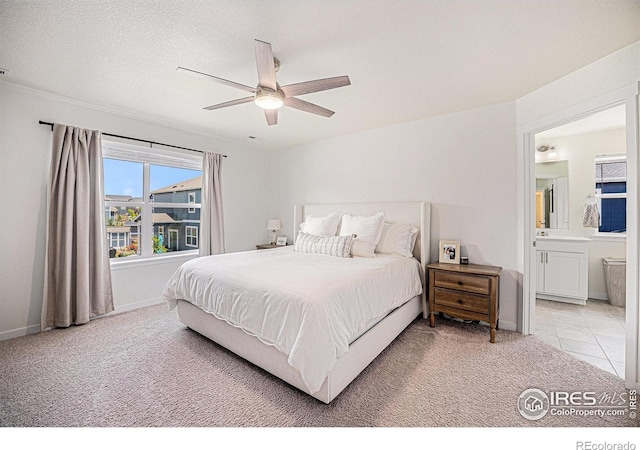 7415 E 158th Pl, Thornton, CO 80602 - bedroom featuring light carpet, ensuite bath, and ceiling fan