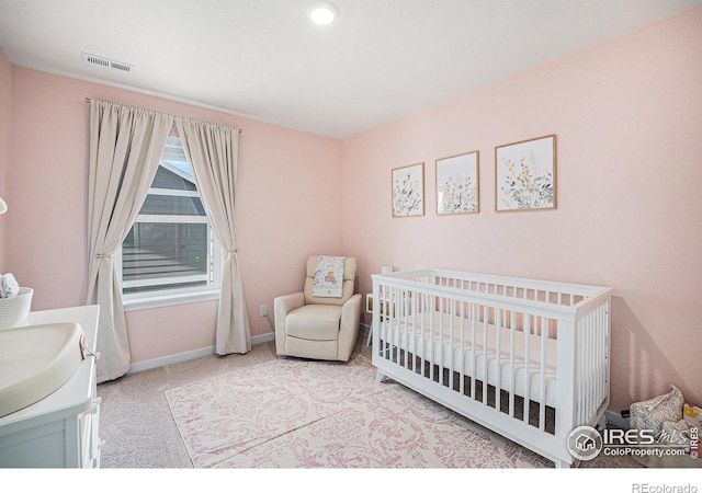 7415 E 158th Pl, Thornton, CO 80602 - bedroom featuring carpet and a crib