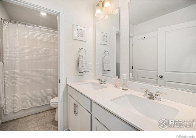 7415 E 158th Pl, Thornton, CO 80602 - full bathroom featuring double vanity and toilet