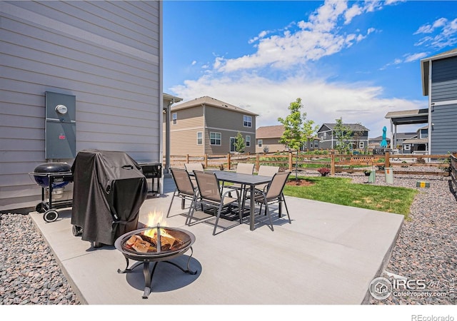 7415 E 158th Pl, Thornton, CO 80602 - view of patio with a fire pit, outdoor dining area, area for grilling, and a residential view