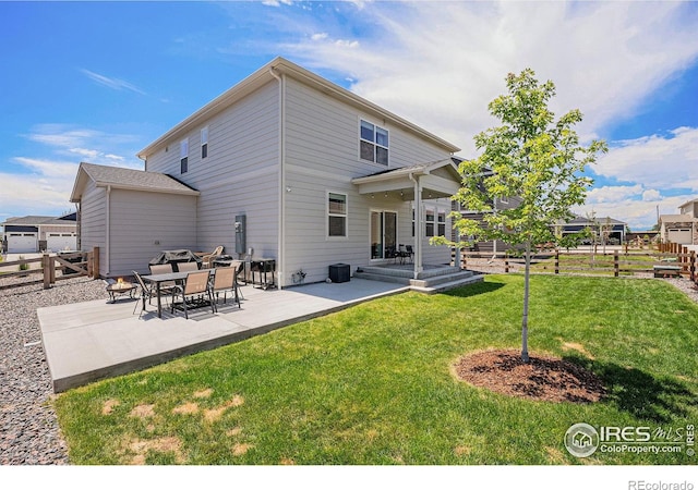 7415 E 158th Pl, Thornton, CO 80602 - back of property featuring a patio and a fenced backyard