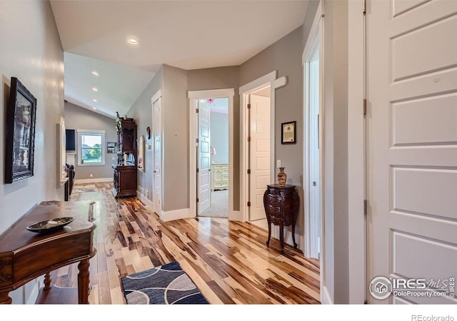 5279 Long Dr, Timnath, CO 80547 - entryway with light wood-style floors, lofted ceiling, and recessed lighting