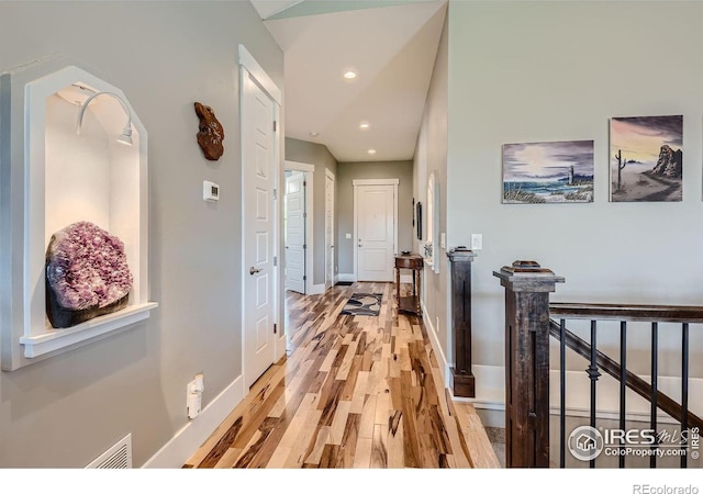 5279 Long Dr, Timnath, CO 80547 - corridor featuring light wood-style flooring, an upstairs landing, and recessed lighting