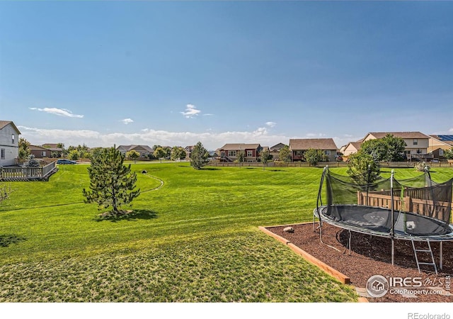 5279 Long Dr, Timnath, CO 80547 - view of yard featuring a trampoline and a residential view