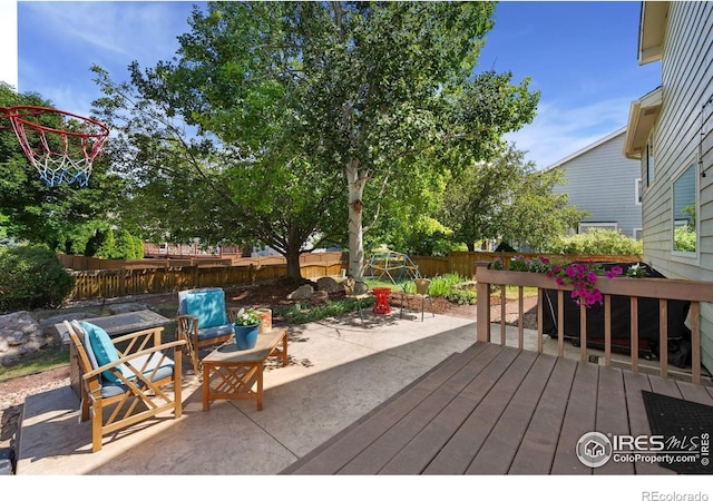 6836 Timpas Dr, Fort Collins, CO 80525 - wooden terrace with a fenced backyard and a patio