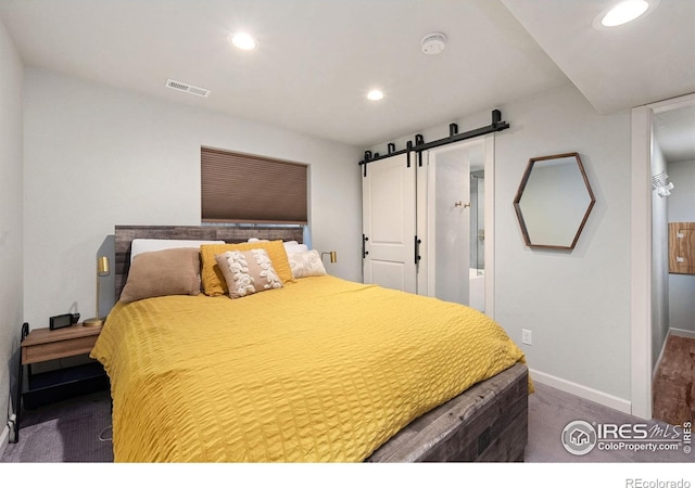 6836 Timpas Dr, Fort Collins, CO 80525 - carpeted bedroom with a barn door, recessed lighting, and ensuite bath