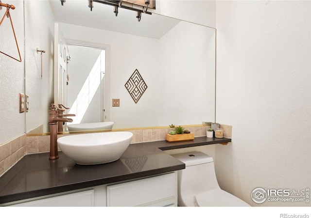 6836 Timpas Dr, Fort Collins, CO 80525 - half bath with vanity and toilet
