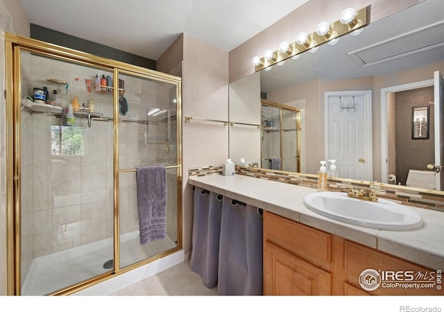6836 Timpas Dr, Fort Collins, CO 80525 - bathroom with a shower stall, vanity, and tile patterned floors