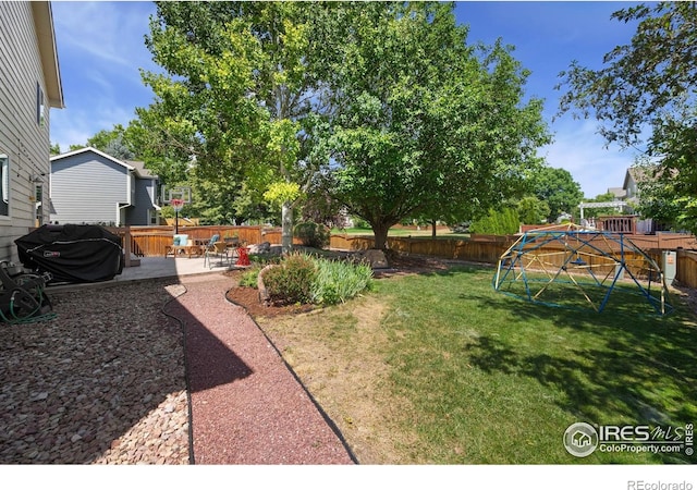 6836 Timpas Dr, Fort Collins, CO 80525 - fenced backyard with a playground and a patio