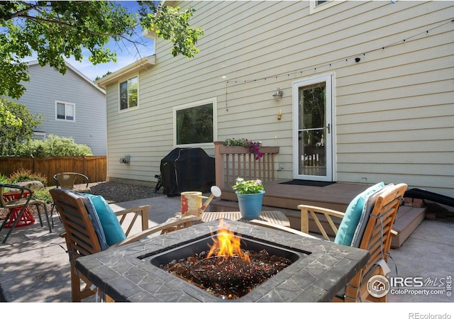 6836 Timpas Dr, Fort Collins, CO 80525 - view of patio with a grill, a fire pit, and a wooden deck