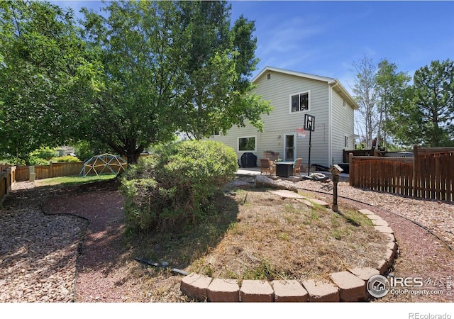 6836 Timpas Dr, Fort Collins, CO 80525 - rear view of house with a fenced backyard