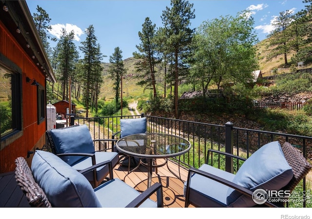 200 Falls Creek Dr, Bellvue, CO 80512 - wooden terrace featuring outdoor dining space