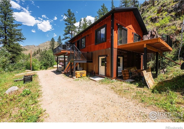 200 Falls Creek Dr, Bellvue, CO 80512 - view of front of home featuring stairway and a deck with mountain view