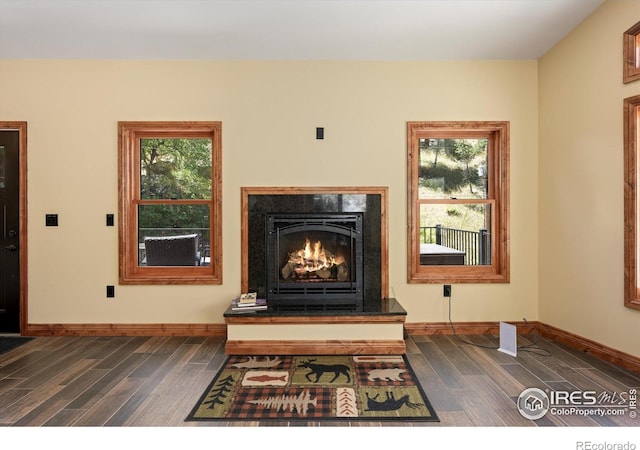 200 Falls Creek Dr, Bellvue, CO 80512 - detailed view of wood finished floors and a warm lit fireplace