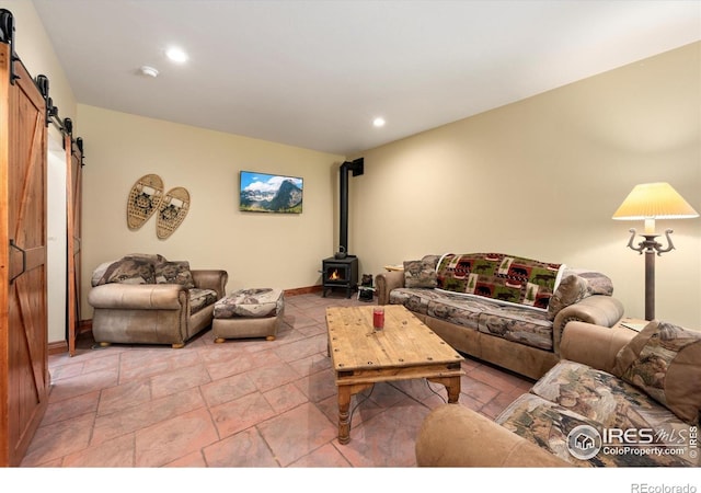 200 Falls Creek Dr, Bellvue, CO 80512 - living room featuring a barn door, a wood stove, and recessed lighting
