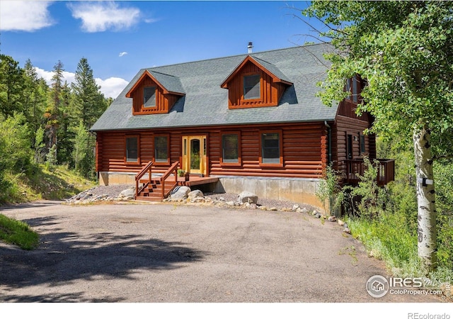 280 Hummer Dr, Nederland, CO 80466 - log home with log exterior and covered porch