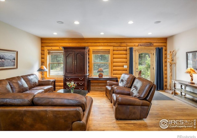 280 Hummer Dr, Nederland, CO 80466 - living room with log walls, recessed lighting, and light wood-style floors