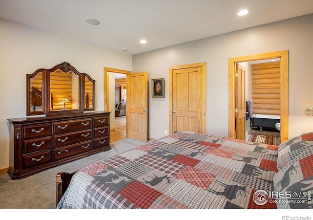280 Hummer Dr, Nederland, CO 80466 - bedroom featuring light carpet, recessed lighting, and ensuite bath
