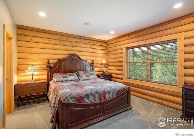 280 Hummer Dr, Nederland, CO 80466 - bedroom with recessed lighting, carpet floors, and log walls