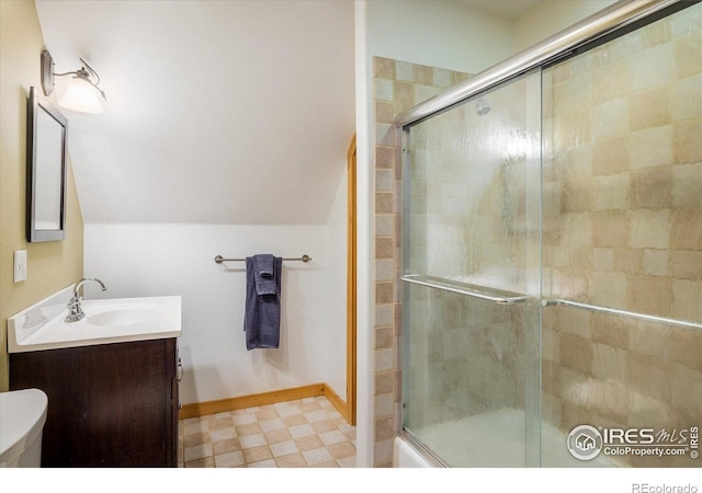 280 Hummer Dr, Nederland, CO 80466 - bathroom featuring vanity, a shower with shower door, and vaulted ceiling