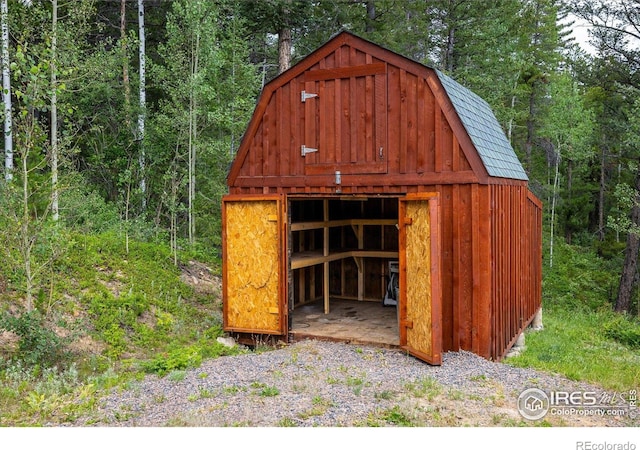 280 Hummer Dr, Nederland, CO 80466 - view of outbuilding featuring a view of trees