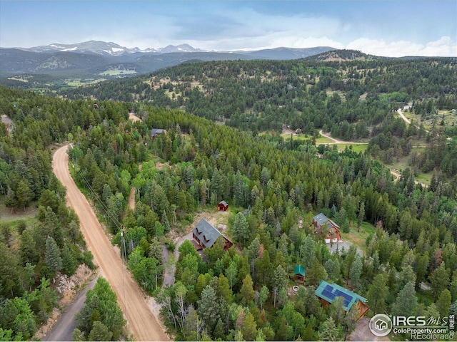280 Hummer Dr, Nederland, CO 80466 - drone / aerial view of a heavily wooded area and a mountain backdrop