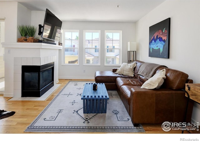 3970 Colorado Ave Unit G, Boulder, CO 80303 - living area with wood finished floors and a tiled fireplace