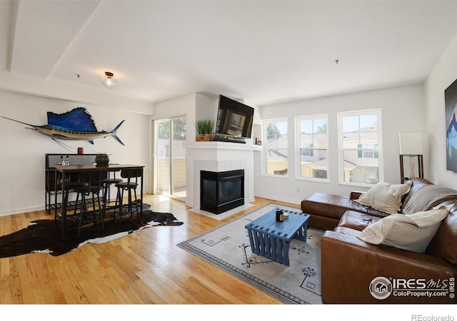 3970 Colorado Ave Unit G, Boulder, CO 80303 - living area with wood finished floors and a tiled fireplace